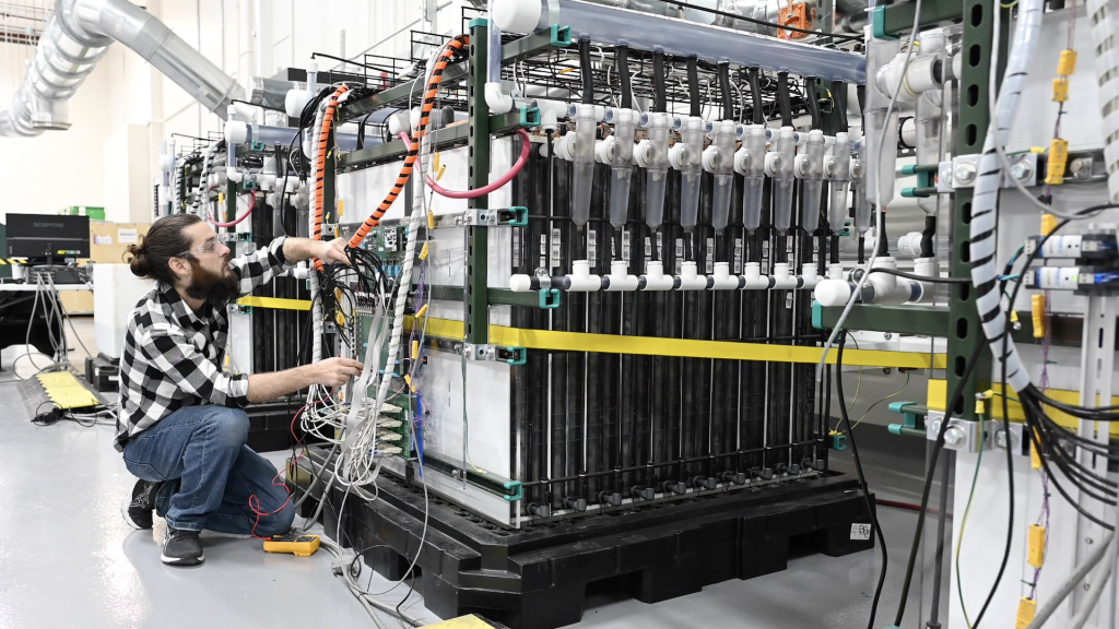 An electrical engineer works on Form Energy's 2022 battery module in the company's lab in Berkeley, California. Image courtesy of Form Energy